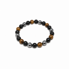 Pulsera Dark Matter de ónix negro, ojo de tigre y hematita sobre fondo blanco